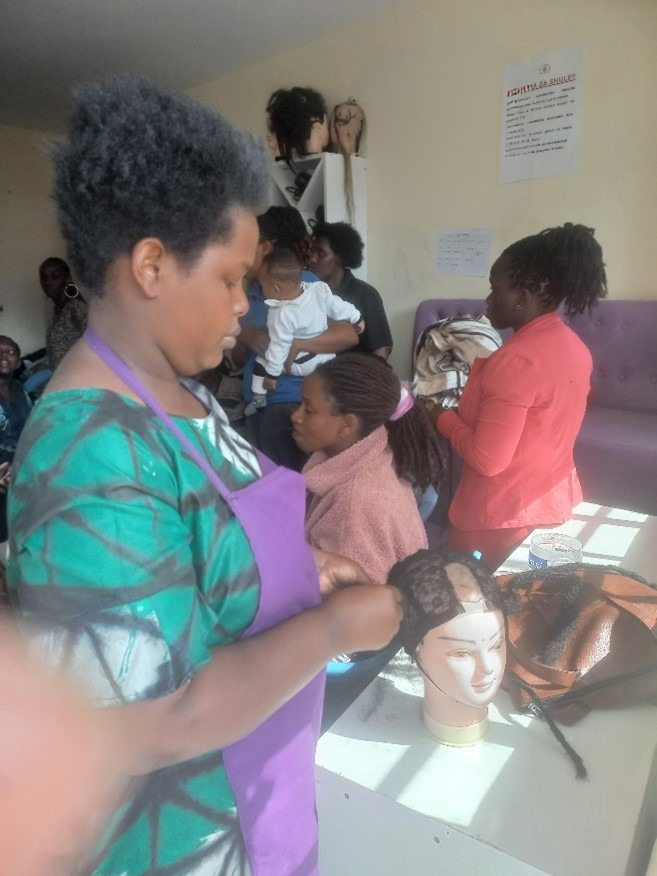 A mother attends FODDAJ Skills training with her child - determination without narration