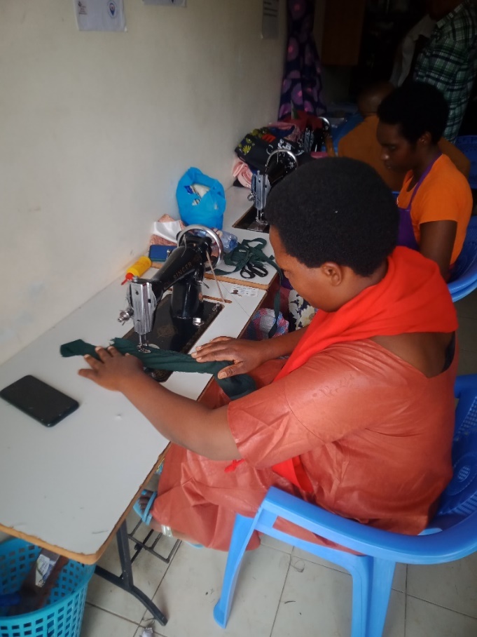 Two tailoring students working side by side